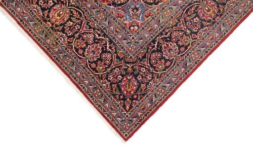 Backside of handmade 1950s Kashan rug showing knot structure and weave density