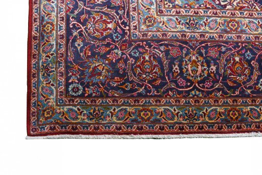 Backside of handmade 2000s Kashan rug showing knot structure and weave density