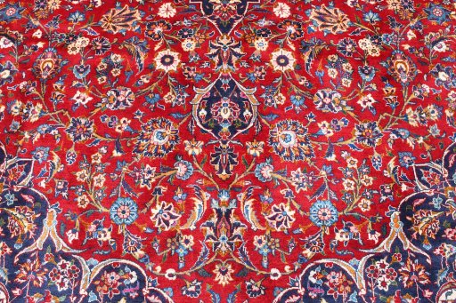 Backside of handmade 2000s Kashan rug showing knot structure and weave density