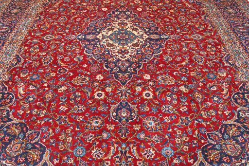 Full view of 2000s Kashan rug from Iran / Persia, 410 × 304 cm in Red tones
