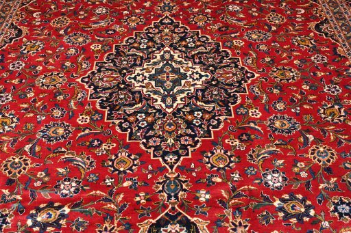 Backside of handmade 2000s Kashan rug showing knot structure and weave density