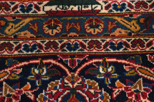 Close-up detail of 2000s Kashan rug from Iran / Persia showing Wool weave