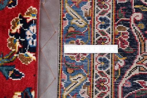 Close-up detail of 2000s Kashan rug from Iran / Persia showing Wool weave