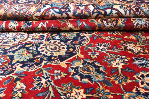 Close-up detail of 2000s Kashan rug from Iran / Persia showing Wool weave