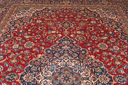 Full view of 2000s Kashan rug from Iran / Persia, 417 × 303 cm in Red tones