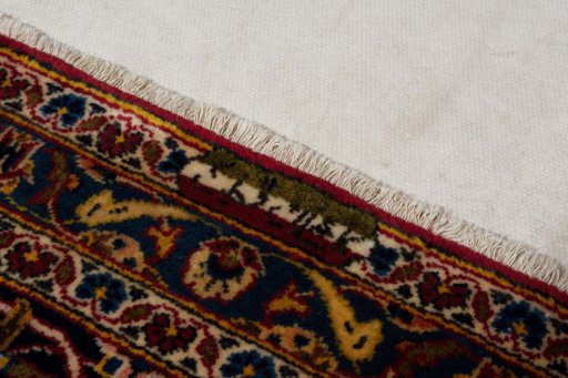 Surface texture of 2000s Kashan rug with natural Wool and intricate pattern