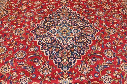 Backside of handmade 2000s Kashan rug showing knot structure and weave density