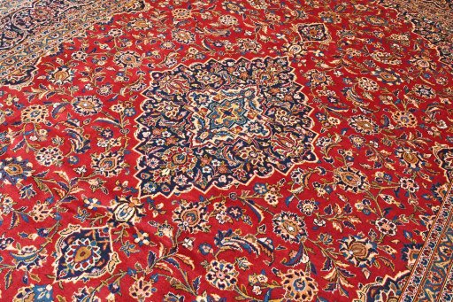 Corner detail of 2000s Kashan rug showing border pattern and Wool pile