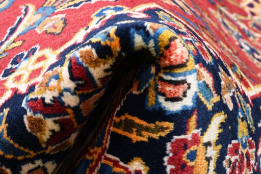 Close-up detail of 2000s Kashan rug from Iran / Persia showing Wool weave