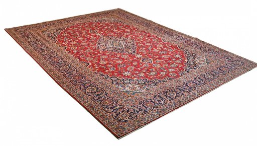 Corner detail of 2000s Kashan rug showing border pattern and Wool pile
