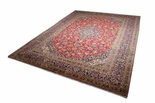 Backside of handmade 2000s Kashan rug showing knot structure and weave density