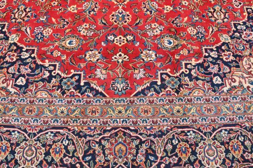 Backside of handmade 2000s Kashan rug showing knot structure and weave density