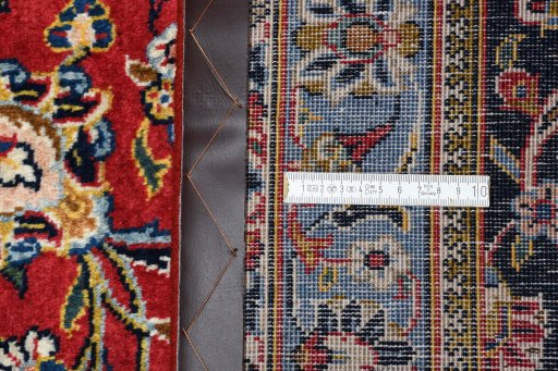 Close-up detail of 2000s Kashan rug from Iran / Persia showing Wool weave