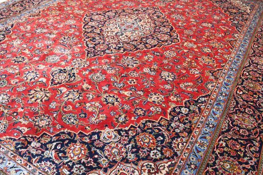 Backside of handmade 2000s Kashan rug showing knot structure and weave density