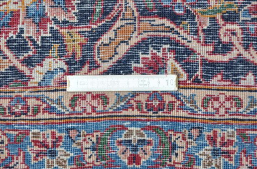 Close-up detail of 1970s Kashan rug from Iran / Persia showing Wool weave