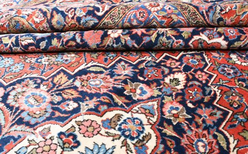 Corner detail of 1930s Kashan rug showing border pattern and Wool pile