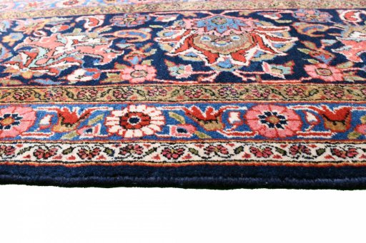 Backside of handmade 1930s Kashan rug showing knot structure and weave density