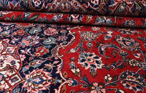 Corner detail of 1970s Kashan rug showing border pattern and Wool pile