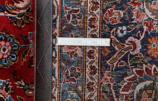 Close-up detail of 1970s Kashan rug from Iran / Persia showing Wool weave