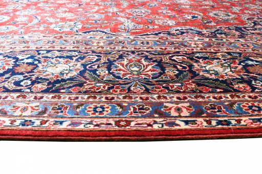 Backside of handmade 1970s Kashan rug showing knot structure and weave density