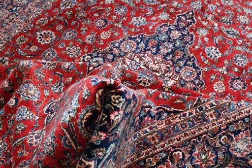 Full view of 1970s Kashan rug from Iran / Persia, 394 × 270 cm in Red tones