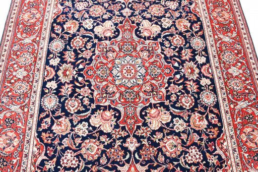 Backside of handmade 1930s Kashan rug showing knot structure and weave density