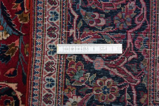 Surface texture of 1930s Kashan rug with natural Cork and intricate pattern