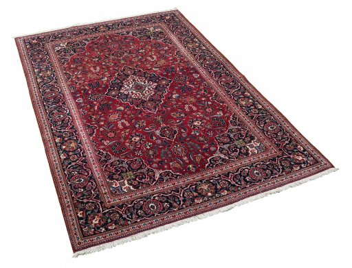 Corner detail of 1930s Kashan rug showing border pattern and Cork pile