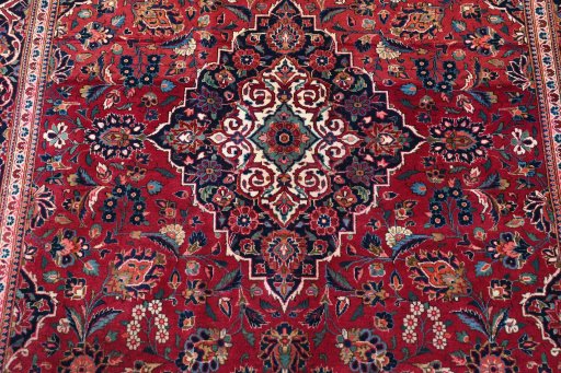 Backside of handmade 1930s Kashan rug showing knot structure and weave density