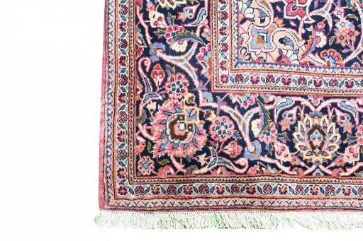 Corner detail of 1930s Kashan rug showing border pattern and Wool pile