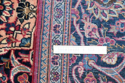 Surface texture of 1930s Kashan rug with natural Wool and intricate pattern