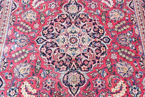 Backside of handmade 1930s Kashan rug showing knot structure and weave density