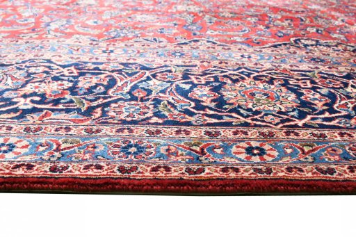 Corner detail of 1970s Kashan rug showing border pattern and Wool pile