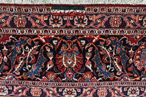 Corner detail of 1930s Kashan rug showing border pattern and Wool pile
