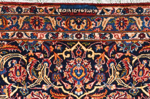 Close-up detail of 2000s Kashan rug from Iran / Persia showing Wool weave