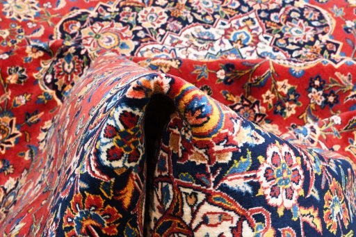 Full view of 2000s Kashan rug from Iran / Persia, 386 × 295 cm in Red tones