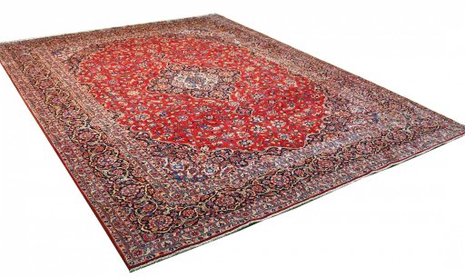 Corner detail of 2000s Kashan rug showing border pattern and Wool pile