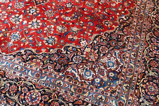 Backside of handmade 2000s Kashan rug showing knot structure and weave density