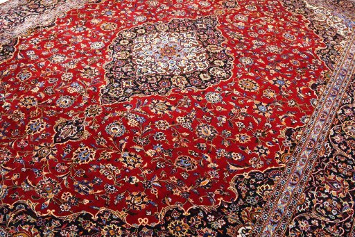 Backside of handmade 2000s Kashan rug showing knot structure and weave density