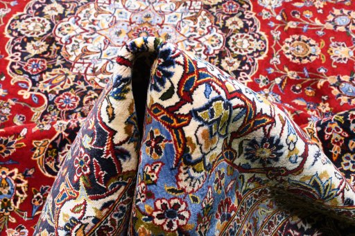 Full view of 2000s Kashan rug from Iran / Persia, 390 × 286 cm in Red tones