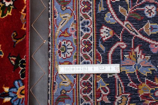 Close-up detail of 2000s Kashan rug from Iran / Persia showing Wool weave