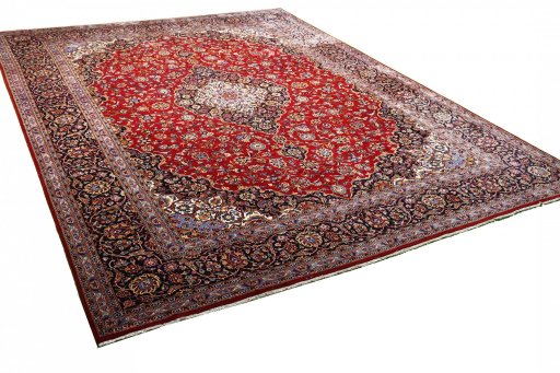 Corner detail of 2000s Kashan rug showing border pattern and Wool pile