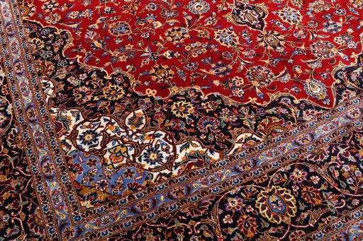 Backside of handmade 2000s Kashan rug showing knot structure and weave density