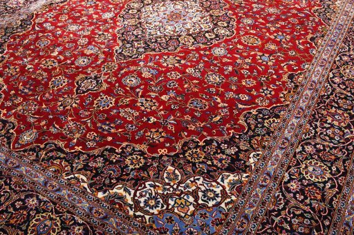 Full view of 2000s Kashan rug from Iran / Persia, 390 × 286 cm in Red tones
