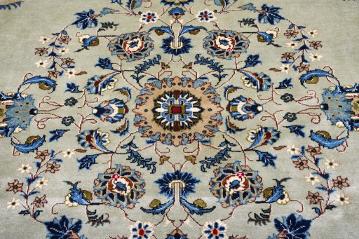 Corner detail of 2000s Kashan rug showing border pattern and Wool pile