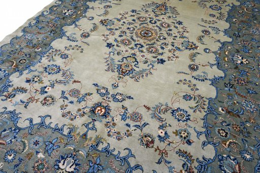 Surface texture of 2000s Kashan rug with natural Wool and intricate pattern
