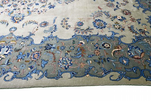 Backside of handmade 2000s Kashan rug showing knot structure and weave density
