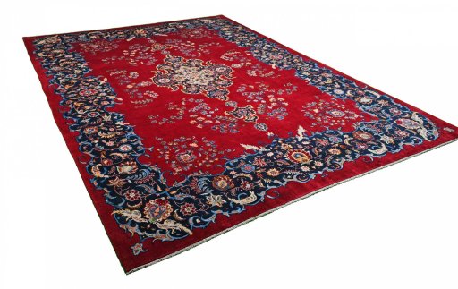 Corner detail of 2000s Kashan rug showing border pattern and Wool pile