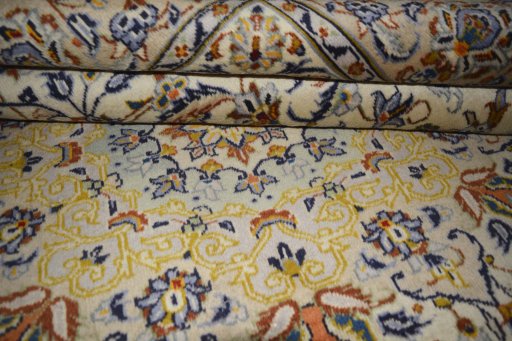 Close-up detail of 2000s Kashan rug from Iran / Persia showing Wool weave