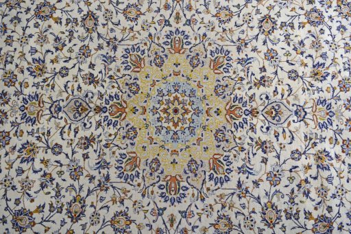 Central medallion detail of 2000s Kashan rug from Iran / Persia